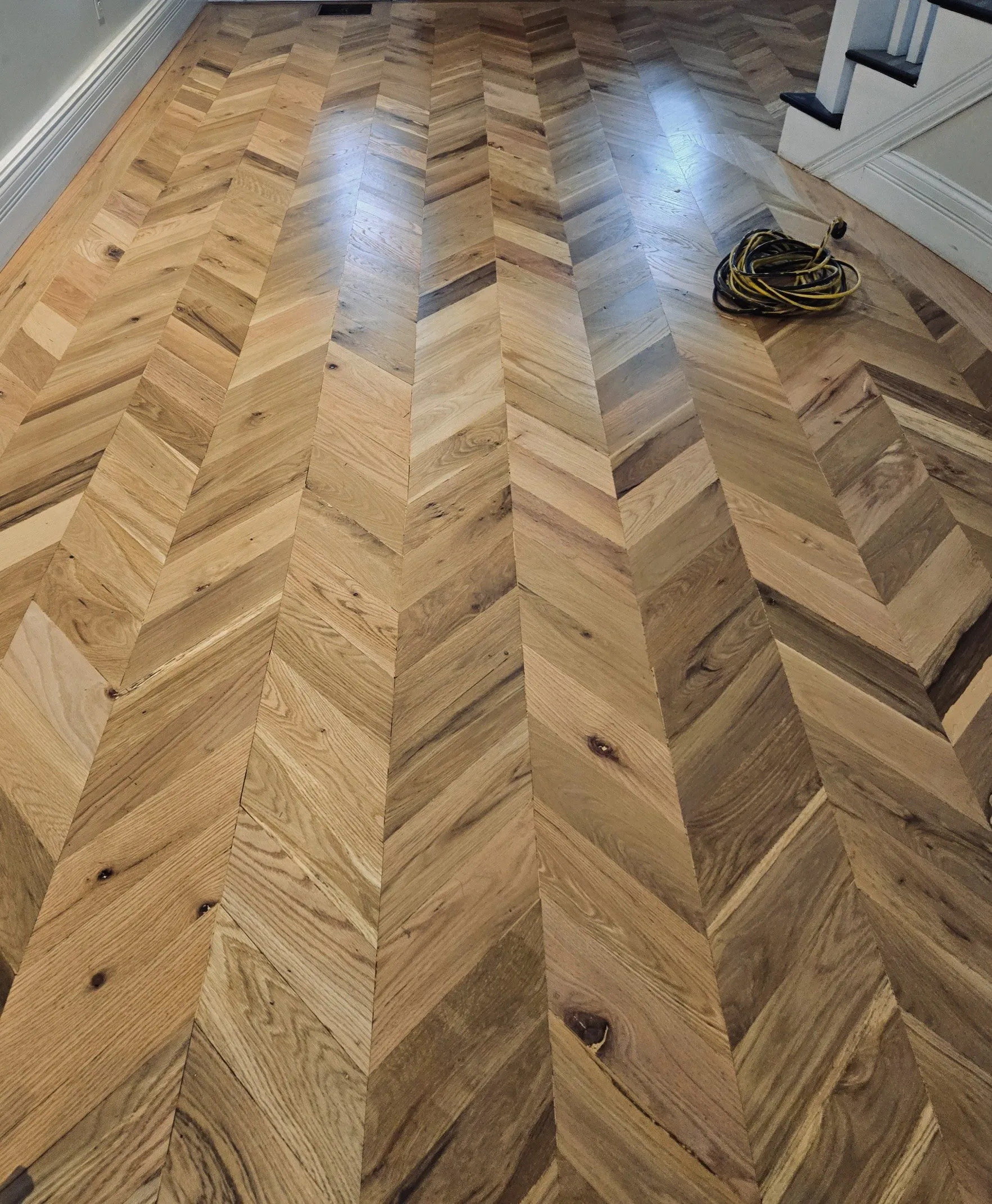Herringbone hardwood floor installed and finished by Moore Hardwood Floors in Lexington, Kentucky