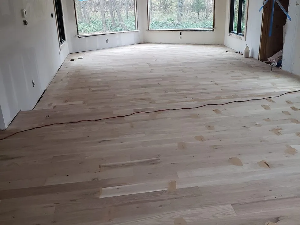 Refinished solid hardwood flooring with a warm satin finish in Lexington, KY